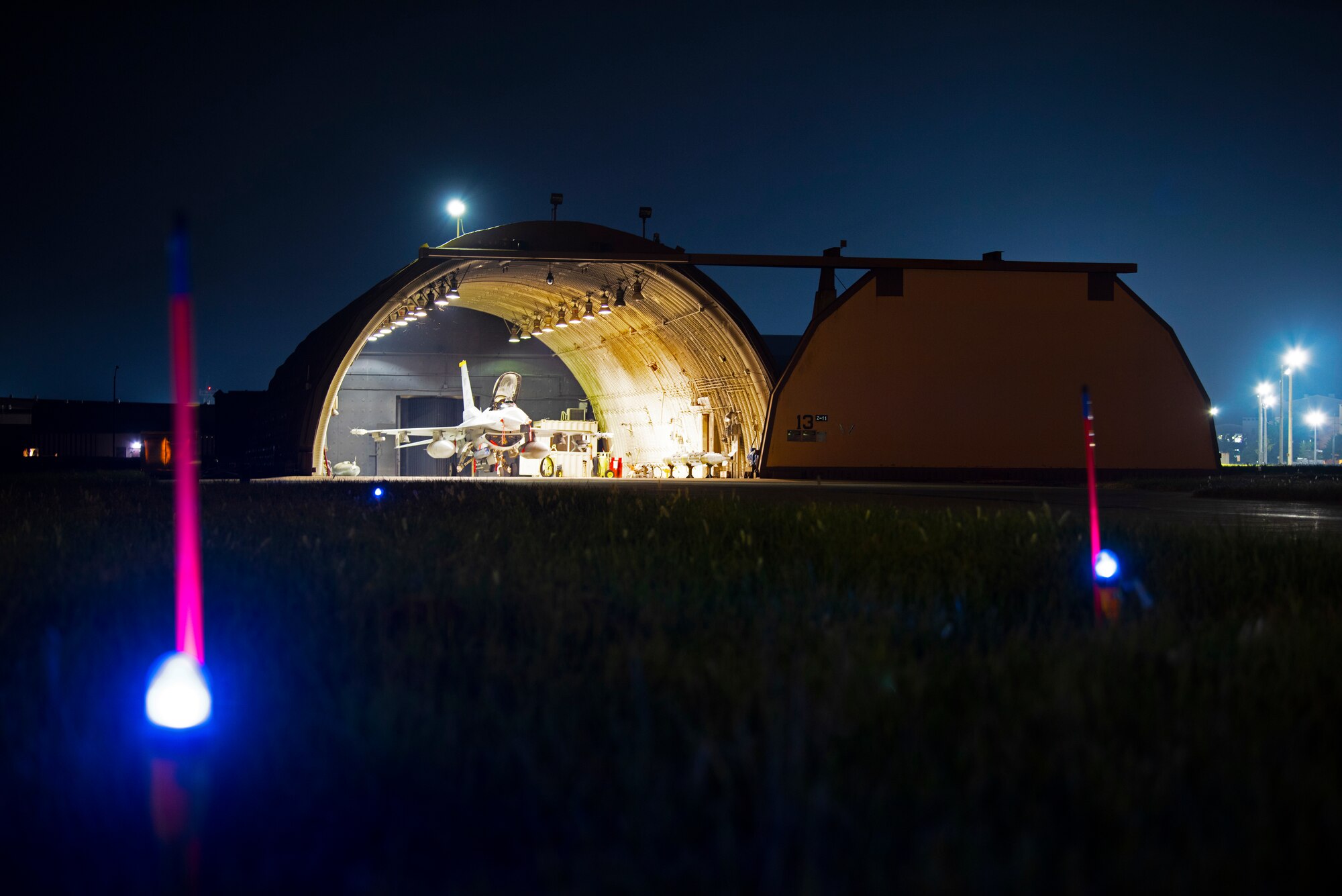 An 8th Fighter Wing F-16 Fighting Falcon from the 80th Fighter Squadron “Juvats” awaits final storage procedures in its hardened aircraft shelter in anticipation Typhoon Soulik Aug. 22, 2018 at Kunsan Air Base, Republic of Korea. The 8th Fighter Wing is conducting extensive preparation for Soulik, which is the first typhoon to directly impact the Korean Peninsula in 6 years. (U.S. Air Force photo by Senior Airman Stefan Alvarez)