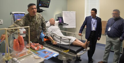 Staff Sgt. John Blaz, Medical Education and Training Campus Interservice Respiratory Therapy Program instructor at Joint Base San Antonio-Fort Sam Houston, talks to San Antonio community members and civic leaders gathered in a lab during the Fort Sam Houston Military Medical Tour Aug. 10. The purpose of the tour, a joint effort between Brooke Army Medical Center Public Affairs and the City of San Antonio Office of Military and Veteran Affairs, was to showcase the contributions of military medicine and its impact on the San Antonio community.