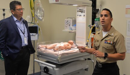 Petty Officer 1st Class Christian Miranda, Medical Education and Training Campus instructor at Joint Base San Antonio-Fort Sam Houston, speaks to San Antonio community members and civic leaders gathered in a neonatal intensive care unit lab during the Fort Sam Houston Military Medical Tour Aug. 10. The purpose of the tour, a joint effort between Brooke Army Medical Center Public Affairs and the City of San Antonio Office of Military and Veteran Affairs, was to showcase the contributions of military medicine and its impact on the San Antonio community.