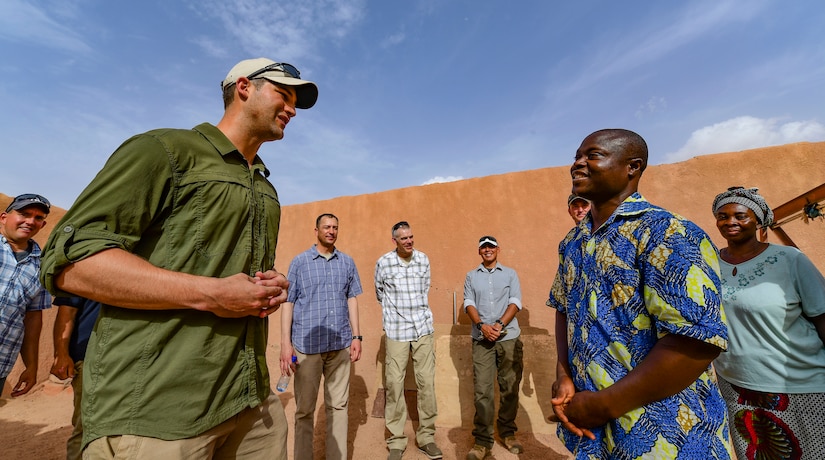 Army Capt. Alexander d’Orchimont, Alpha Company, 411th Civil Affairs Battalion team leader, speaks to a Nigerien orphanage volunteer in Agadez, Niger.