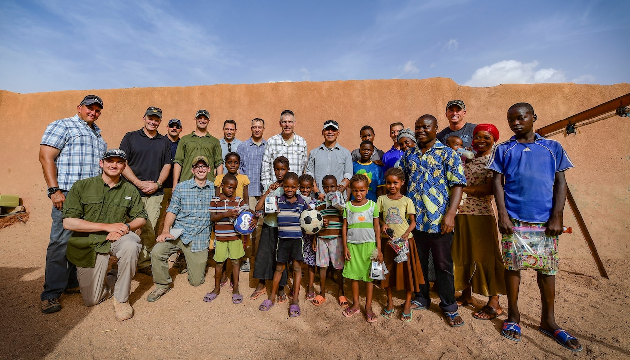 U.S. service members gather for a photo with children and volunteers from an orphanage in Agadez, Niger.