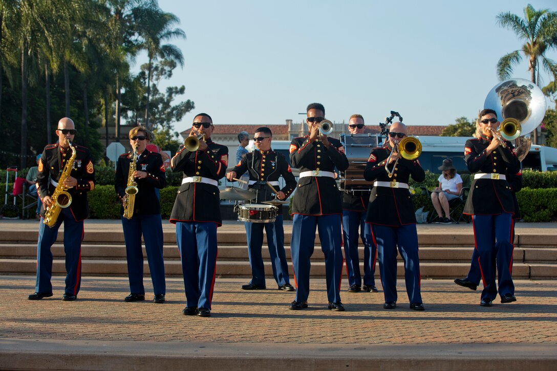 Marines with Marine Band San Diego, Service Company, Headquarters Service Battalion, perform prior to the Twilight in the Park concert at Balboa Park in San Diego, Aug. 21. The Marines caught the attention of civilians and advertised the concert. The Twilight in the Park concert is an annual event designed to strengthen relationships between the U.S. Marines and the local community.