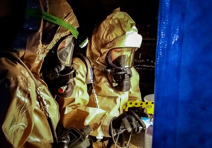 U.S. Air Force Tech. Sgt. Tara Broad, survey member in the 10th Civil Support Team, Washington National Guard, takes pictures of raw materials that could be used to create nefarious chemicals, explosives or drugs during exercise Konfitma Aug. 17, 2018, on the island of Saipan. Konfitma is an all-hazards CBRNE environment threat-based training exercise designed to test an agency’s capabilities, policies and procedures and to identify capability and interoperability gaps.