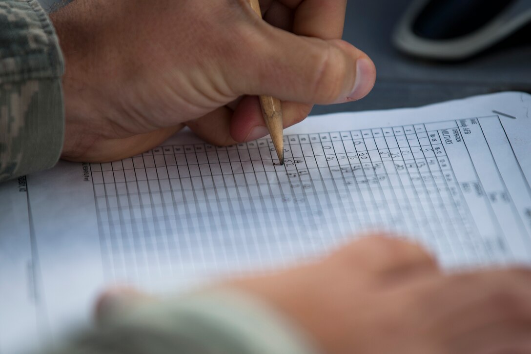 Tech. Sgt. Justin Sprayberry, 23d Operations Support Squadron air traffic controller, logs aircraft operations, Aug. 15, 2018, at Moody Air Force Base, Ga. Air traffic controllers direct runway operations by sequencing and separating aircraft, issuing safety alerts, ensuring the safety of pilots and managing the expeditious flow of traffic. (U.S. Air Force photo by Airman Taryn Butler)