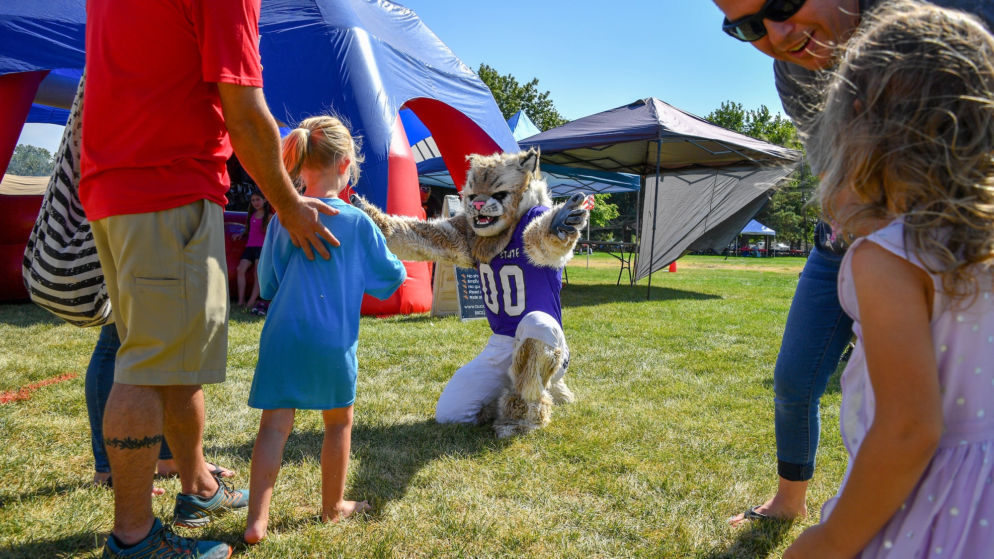Waldo Wildcat, Weber State University's mascot, interacts with families during the Salute Picnic Aug. 17, 2018, at Hill Air Force Base, Utah. The picnic was hosted by the Top of Utah Mlitary Affairs Committee and serves to thank service members and their families for their service. (U.S. Air Force photo by R. Nial Bradshaw)