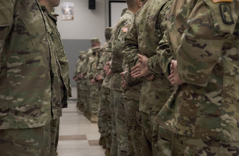Soldiers with the 78th Training Division stand at parade rest during a change of command ceremony on Joint Base McGuire-Dix-Lakehurst, N.J., Aug. 11, 2018. The division is an Army reserve unit that trains and evaluates Army units for deployment. The division was activated in 1917 consisting of four infantry and three artillery regiments. (U.S. Air Force photo by Airman Ariel Owings)