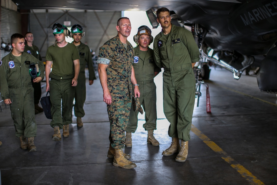 Brig. Gen. Michael Borgschulte, the 3rd Marine Aircraft Wing Assistant Wing Commander, visits with Marines from around Marine Aircraft Group 13 during Exercise Northern Lightning at Volk Field Counterland Training Center, Camp Douglas, Wis. Aug. 16. Exercise Northern Lightning 2018 allows the Air Force, Marine Corps and Navy to strengthen interoperability between services and gives the different branches a greater understanding of aviation capabilities within a joint fighting force. (U.S. Marine Corps photo by Sgt. David Bickel)