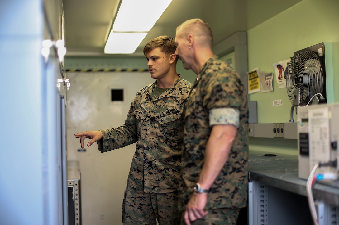 Brig. Gen. Michael Borgschulte, the 3rd Marine Aircraft Wing Assistant Wing Commander, visits with Marines from around Marine Aircraft Group 13 during Exercise Northern Lightning at Volk Field Counterland Training Center, Camp Douglas, Wis. Aug. 16. Exercise Northern Lightning 2018 allows the Air Force, Marine Corps and Navy to strengthen interoperability between services and gives the different branches a greater understanding of aviation capabilities within a joint fighting force. (U.S. Marine Corps photo by Sgt. David Bickel)
