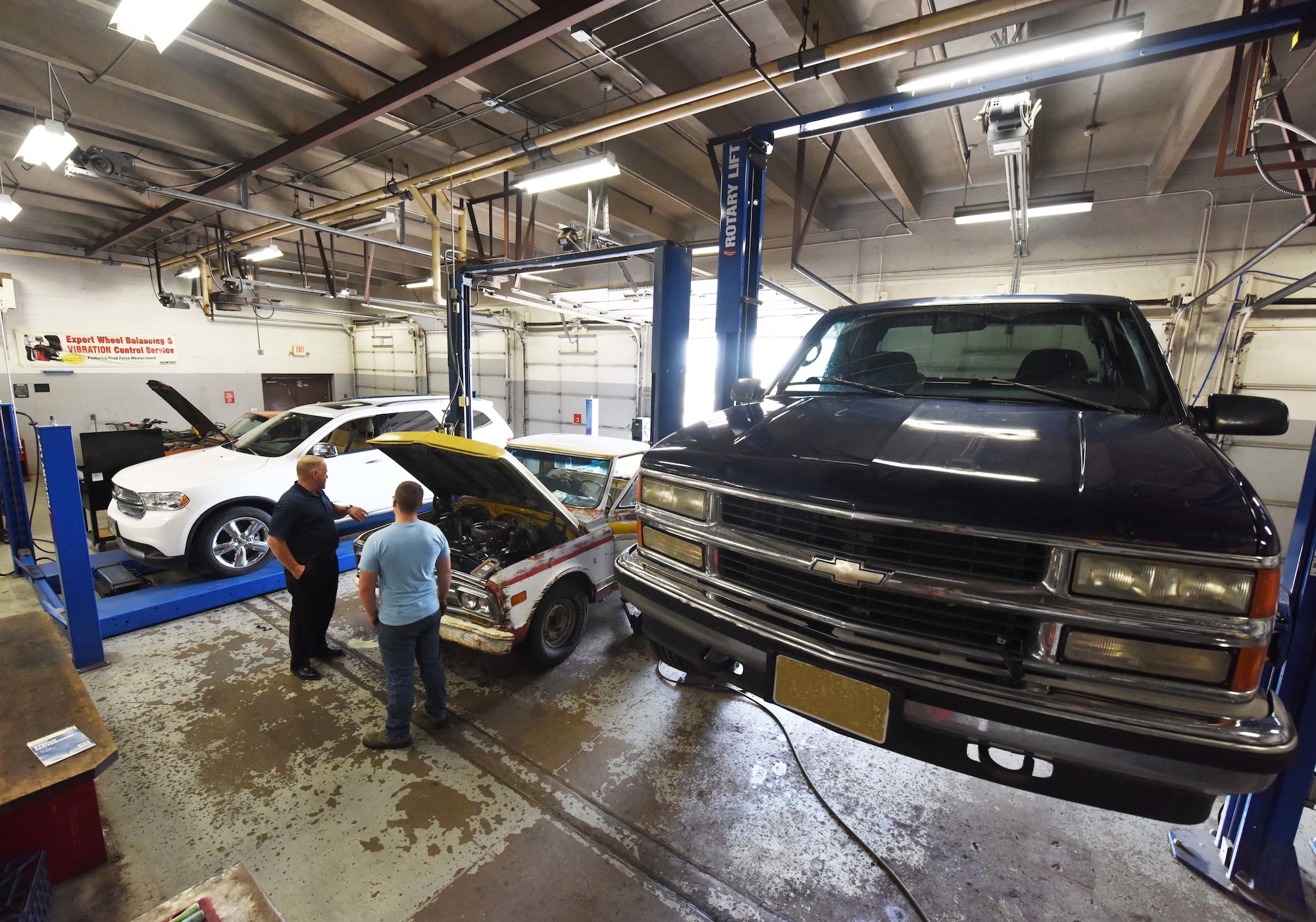 Vehicles undergo routine maintenance in the auto hobby shop at Ellsworth Air Force Base, S.D., Aug. 15, 2018. The mechanics at the hobby shop are here to help Airmen and their families with their automotive repair needs and to help car enthusiasts with their projects. (U.S. Air Force Photo by Airman 1st Class Thomas Karol)