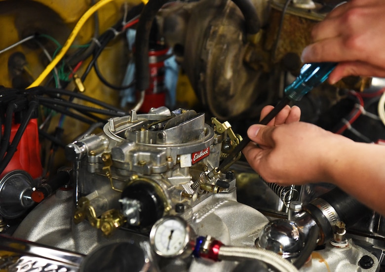 Senior Airman John Burroughs, a 28th Maintenance Squadron avionics apprentice, works on his truck at Ellsworth Air Force Base, S.D., Aug. 15, 2018. Airmen are welcome to come fix or upgrade their vehicles at the auto hobby shop and take advantage of the other services the mechanics provide. (U.S. Air Force Photo by Airman 1st Class Thomas Karol)