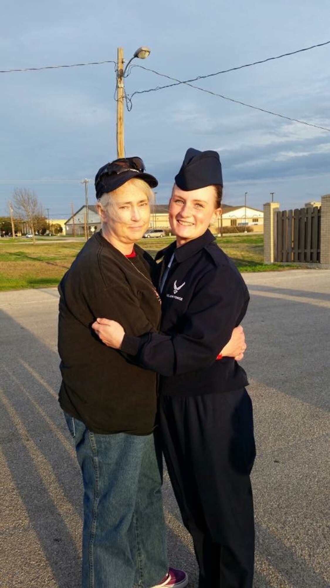 Mary Nevins (left) hugs her daughter, Denise, after her graduation from Air Force basic training at Lackland Air Force Base, Texas, Jan. 30, 2015. Mary’s daughter, now Senior Airman Denise Jenson, currently works for the 28th Bomb Wing Public Affairs office at Ellsworth Air Force Base, S.D. (Courtesy photo)