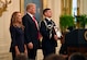 Valerie Nessel, the spouse of Tech. Sgt. John Chapman, stands as the citation is read before receiving the Medal of Honor from President Donald J. Trump during a ceremony at the White House in Washington, D.C., Aug. 22, 2018. Chapman was posthumously awarded the Medal of Honor for actions on Takur Ghar mountain in Afghanistan on March 4, 2002, when his elite special operations team was ambushed by the enemy and came under heavy fire from multiple directions. Chapman immediately charged an enemy bunker through thigh-deep snow and killed all enemy occupants. Courageously moving from cover to assault a second machine gun bunker, he was injured by enemy fire. Despite severe wounds, he fought relentlessly, sustaining a violent engagement with multiple enemy personnel before making the ultimate sacrifice. With his last actions, he saved the lives of his teammates. (U.S. Air Force photo by Wayne A. Clark)