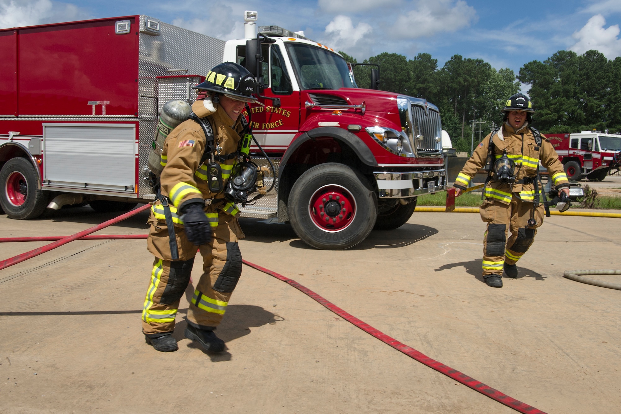 U.S. Air Force Senior Airman Brianna Senatore and Staff Sgt. Zachery Sodon both firefighters with the Air Force Reserve's 514th Civil Engineer Squadron from Joint Base McGuire-Dix-Lakehurst, New Jersey, respond to a simulated three-story building fire during Patriot Warrior at Dobbins Air Reserve Base, Georgia, Aug. 17, 2018. The Patriot Warrior exercise supports the Air Force Reserve guiding and foundational principles of preserving, building and shaping a combat ready, cost effective, experienced and sustainable professional military force. (U.S. Air Force photo by Master Sgt. Theanne Herrmann)