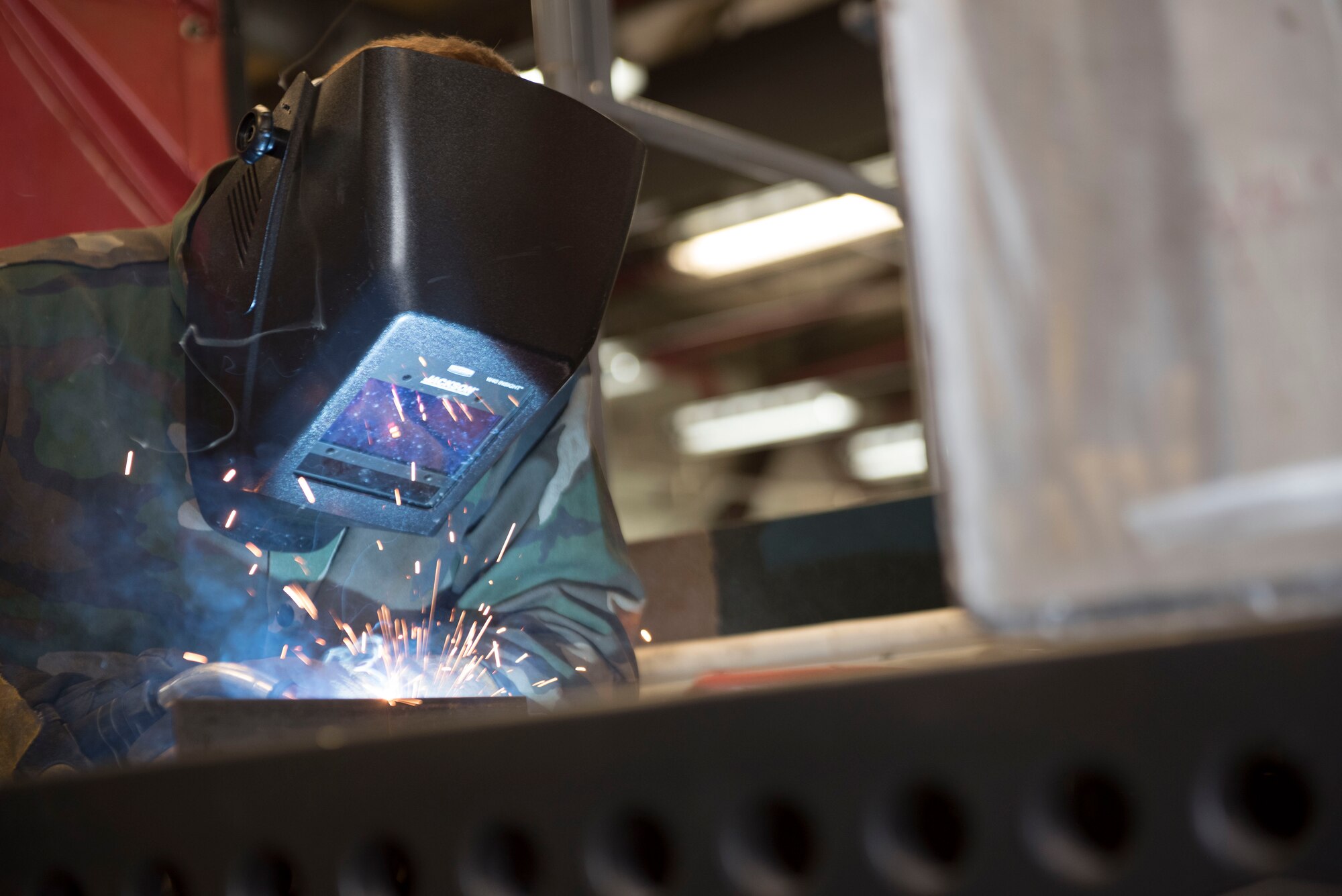 U.S. Air Force Senior Airman Tyler Miller, 18th Equipment Maintenance Squadron metals technology journeyman, welds a piece of angular metal Aug. 20, 2018, at Kadena Air Base, Japan. Airmen within the 18th EMS train to understand the differences between metals, how they react to different types of stress and the appropriate techniques to marry them through welding. (U.S. Air Force photo by Senior Airman Quay Drawdy)
