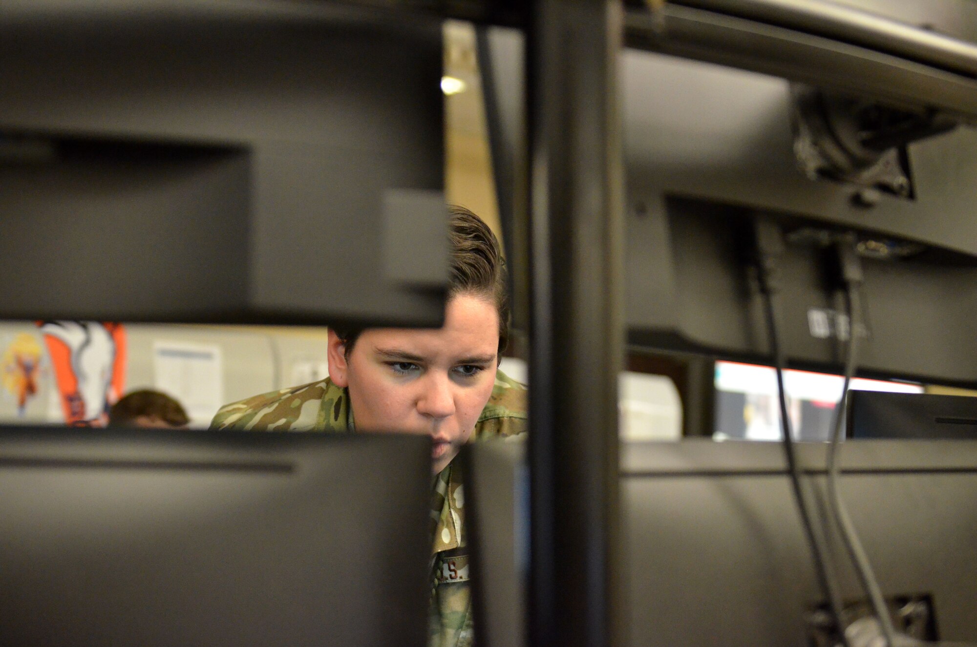 Airman 1st Class Courtney Sherman, a cyber transport technicians assigned to the 609th Expeditionary Air Communications Squadron (EACOMS), checks a call manager program Aug. 8, 2018, at Al Udeid Air Base, Qatar. This program controls all unclassified phones in the Combined Air Operations Center which provides airpower throughout the U.S. Central Command Area of Responsibility which spreads over 20 nations. (U.S. Air Force photo by Staff Sgt. Caitlin Conner)
