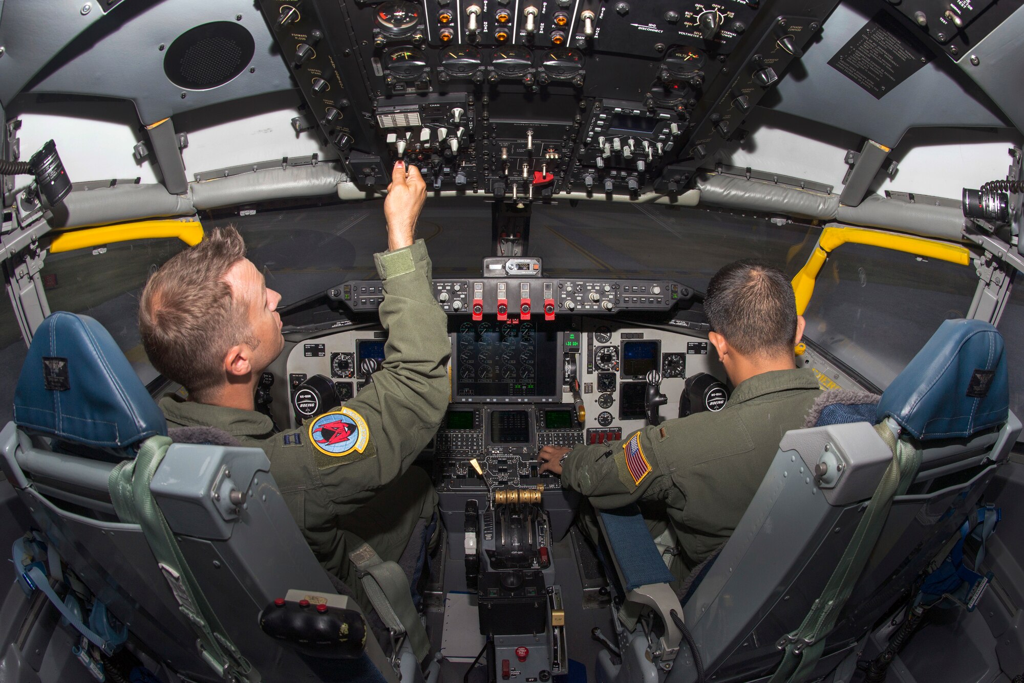 U.S. Air Force Capt. Josh Welch, left, and 2nd Lt. Kent Melendez, right, both pilots assigned to the 50th Air Refueling Squadron, perform pre-flight procedures in the KC-135 flight simulator at MacDill Air Force Base, Fla, Aug. 17, 2018.