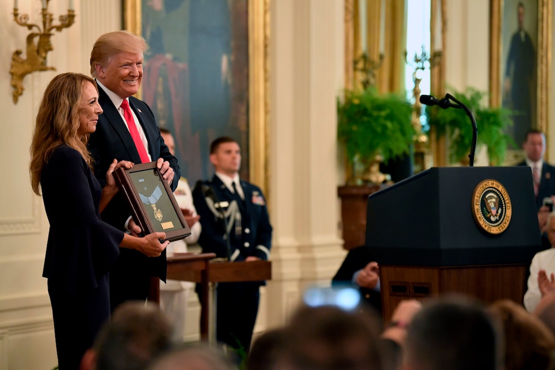 President Donald J. Trump presents the Medal of Honor to the widow of Air Force Tech. Sgt. John Chapman.