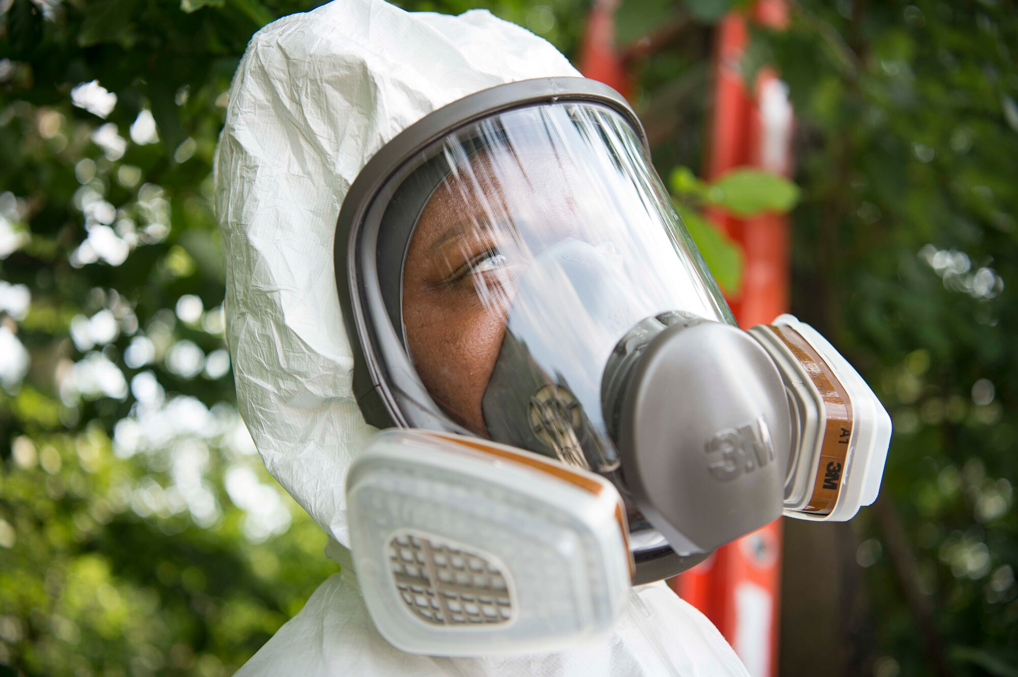U.S. Air Force Senior Airman William Bishop, 786th Civil Engineer Squadron technician, wears a pest control suit on Ramstein Air Base, Germany, Aug. 7, 2018. Pest management conducts base-wide inspections and preventative maintenance, and rids unwanted pests on the installation, including venomous insects, burrowing mammals, and unsanitary rodents. (U.S. Air Force photo by Senior Airman Elizabeth Baker)