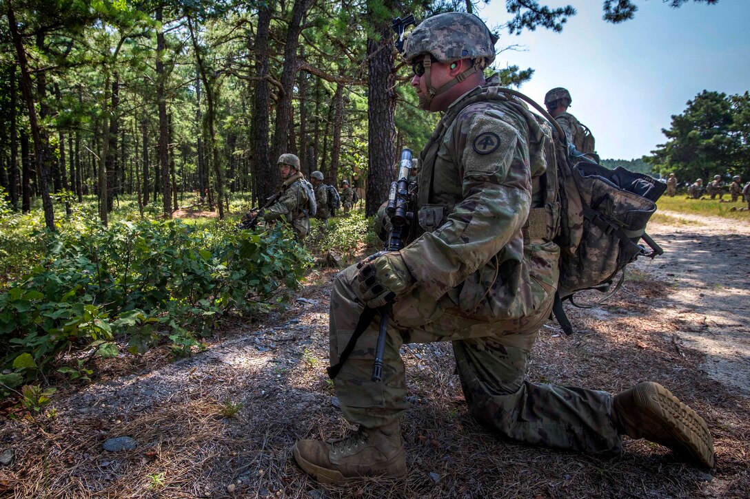 Soldiers take up defensive positions before conducting a live-fire exercise.