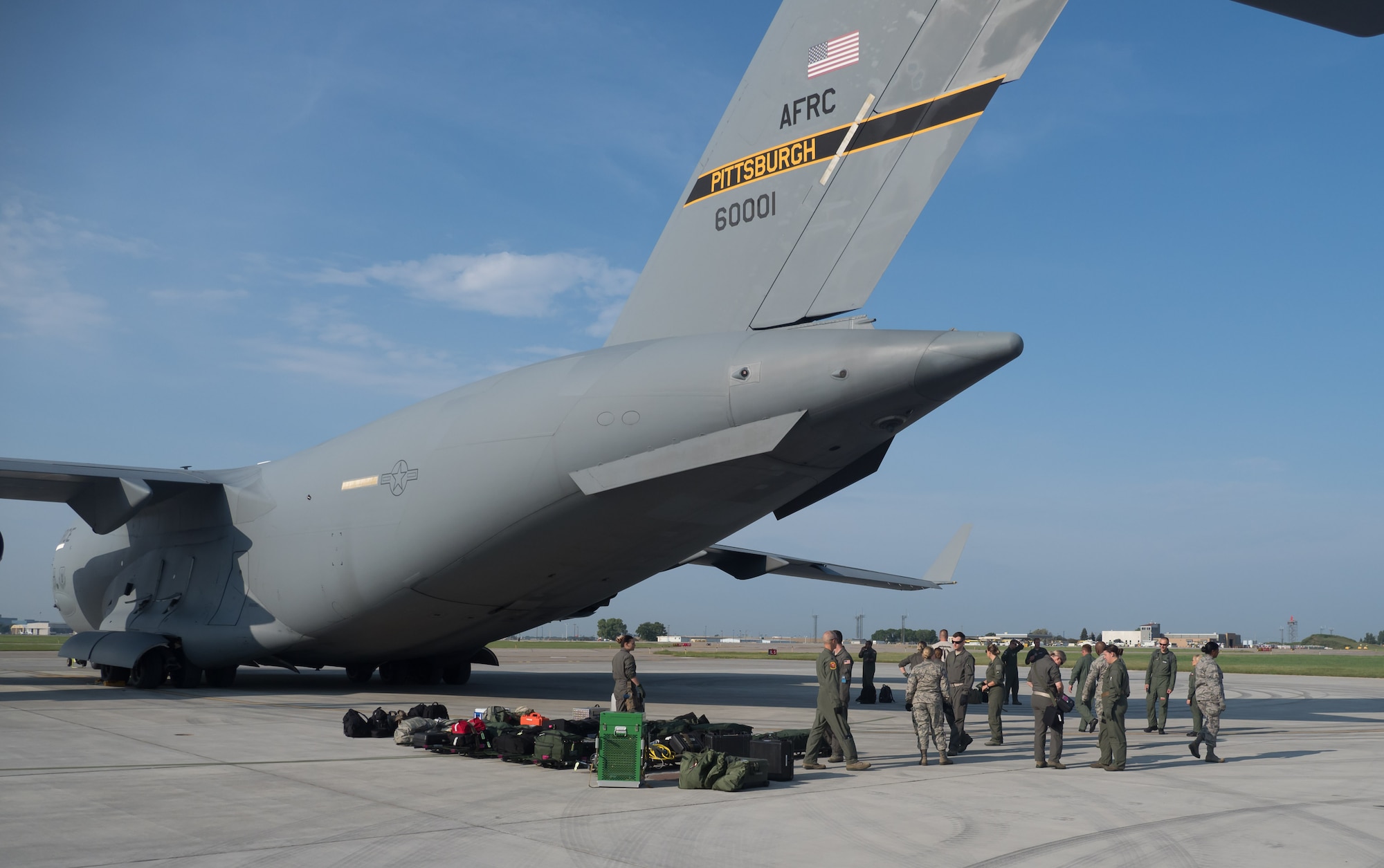 Airmen prepare to load AES patients aboard a C-17 at Minneapolis St. Paul Air Reserve Station for transport to Ft. McCoy, Wis. as part of Exercise Patriot Warrior (Air Force Photo/Paul Zadach)