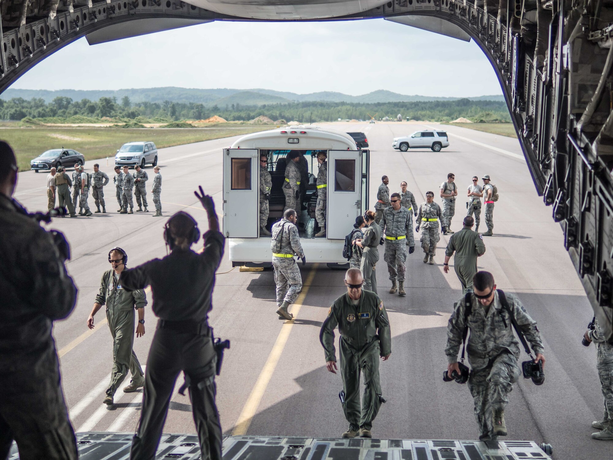 Airmen load AES and CCAT patients on to the C-17 at Fort McCoy Wis. (Air Force Photo/Paul Zadach)