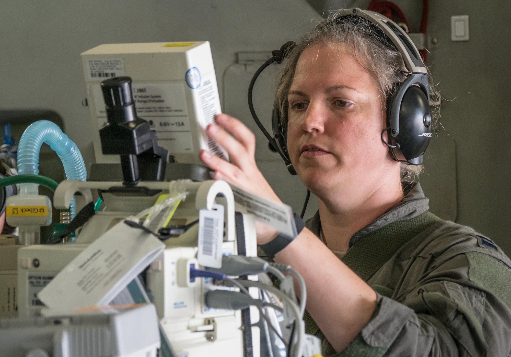 Capt. Tiffany Prochaska, 81st Medical Group, Keesler AFB, Miss., reads data from the life support equipment as part of the CCATT. (Air Force Photo/Paul Zadach)