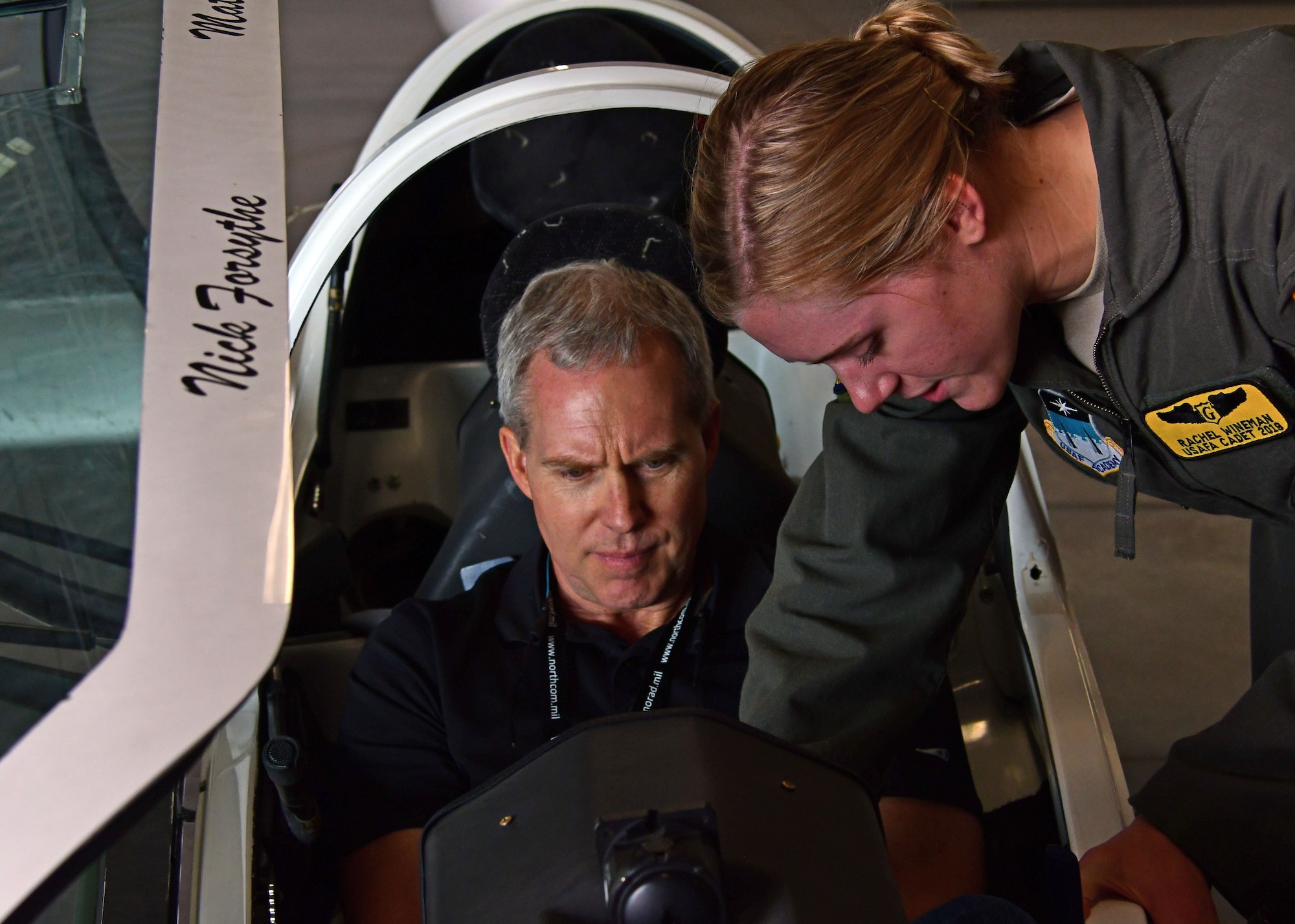 Tim Kelly, a civic leader from Georgia, sits in a glider as a U.S. Air Force Academy cadet points out controls in the cockpit during a tour August 15, 2018. Civic leaders were invited for the first time to the 22nd Air Force’s Senior Leader Summit held in August 2018. (U.S. Air Force photo/Staff Sgt. Andrew Park)