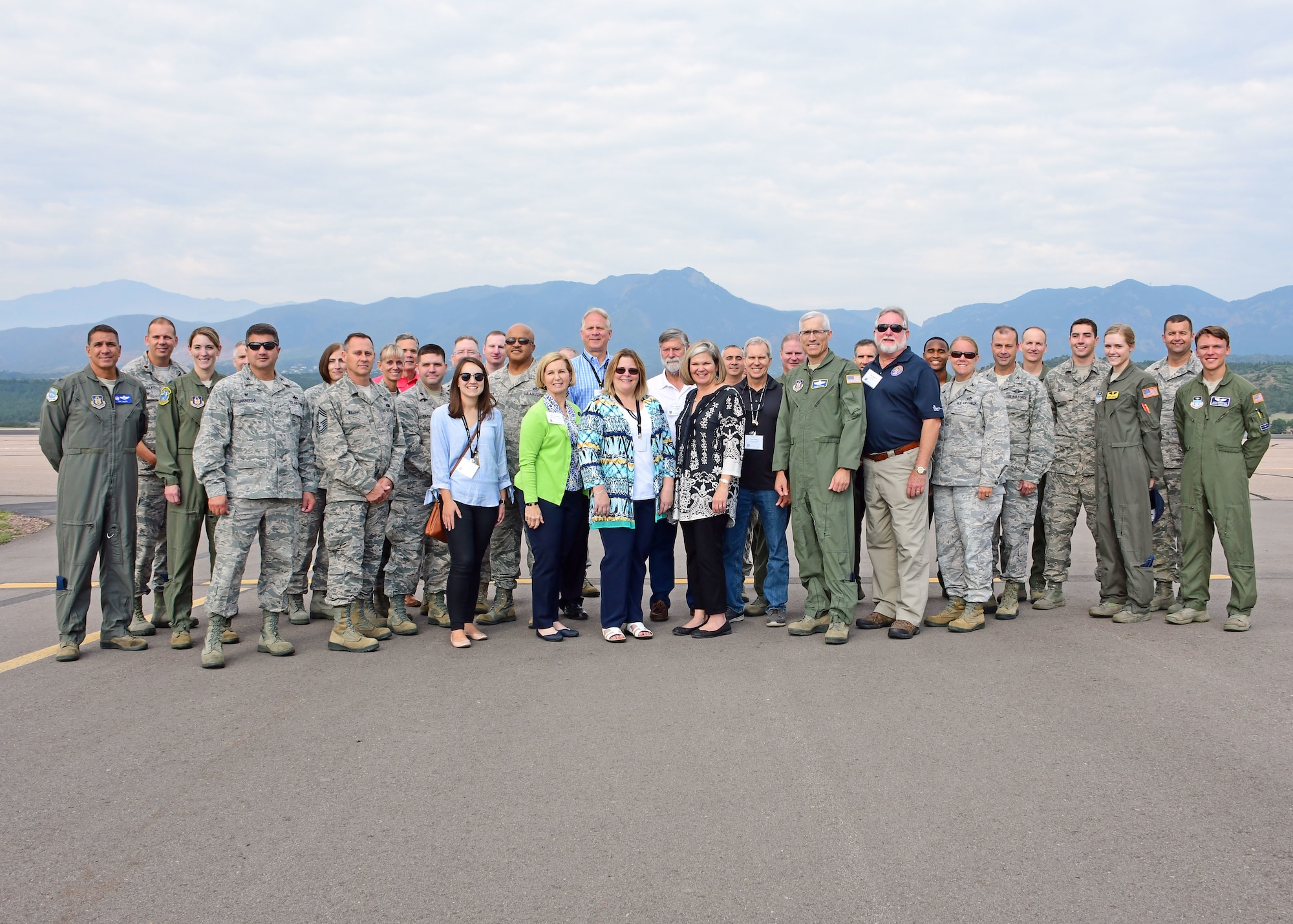 Participants in the 22nd Air Force Senior Leader Summit pose for a group photo by the U.S. Air Force Academy flightline Aug. 15, 2018. Military members and civilians embarked on a variety of tours to learn more about the Air Force as a whole, as well as the unique mission sets that make up the command. (U.S. Air Force photo/Staff Sgt. Andrew Park)