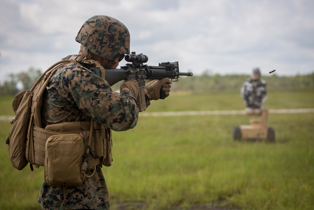 A U.S. Marine with 2nd Combat Engineer Battalion, 2nd Marine Division, fires at marathon targets at Camp Lejeune, N.C., Aug. 22, 2018. Marathon Targets are newly implemented moving targets that are unpredictable and more closely resemble real world combat in order to better prepare Marines for future contingencies.