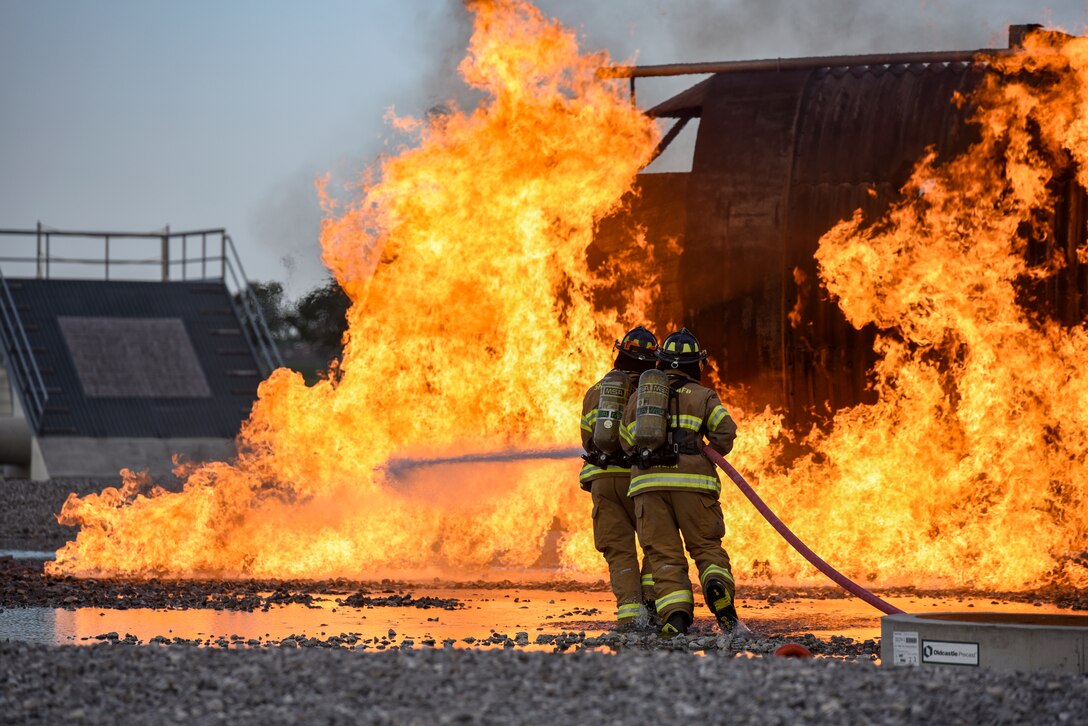 Fire fighters train at a special training area that simulates a plane crash.