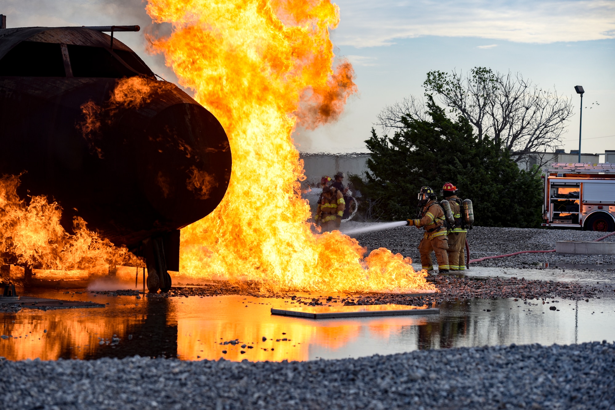 Fire fighters train at a special training area that simulates a plane crash.