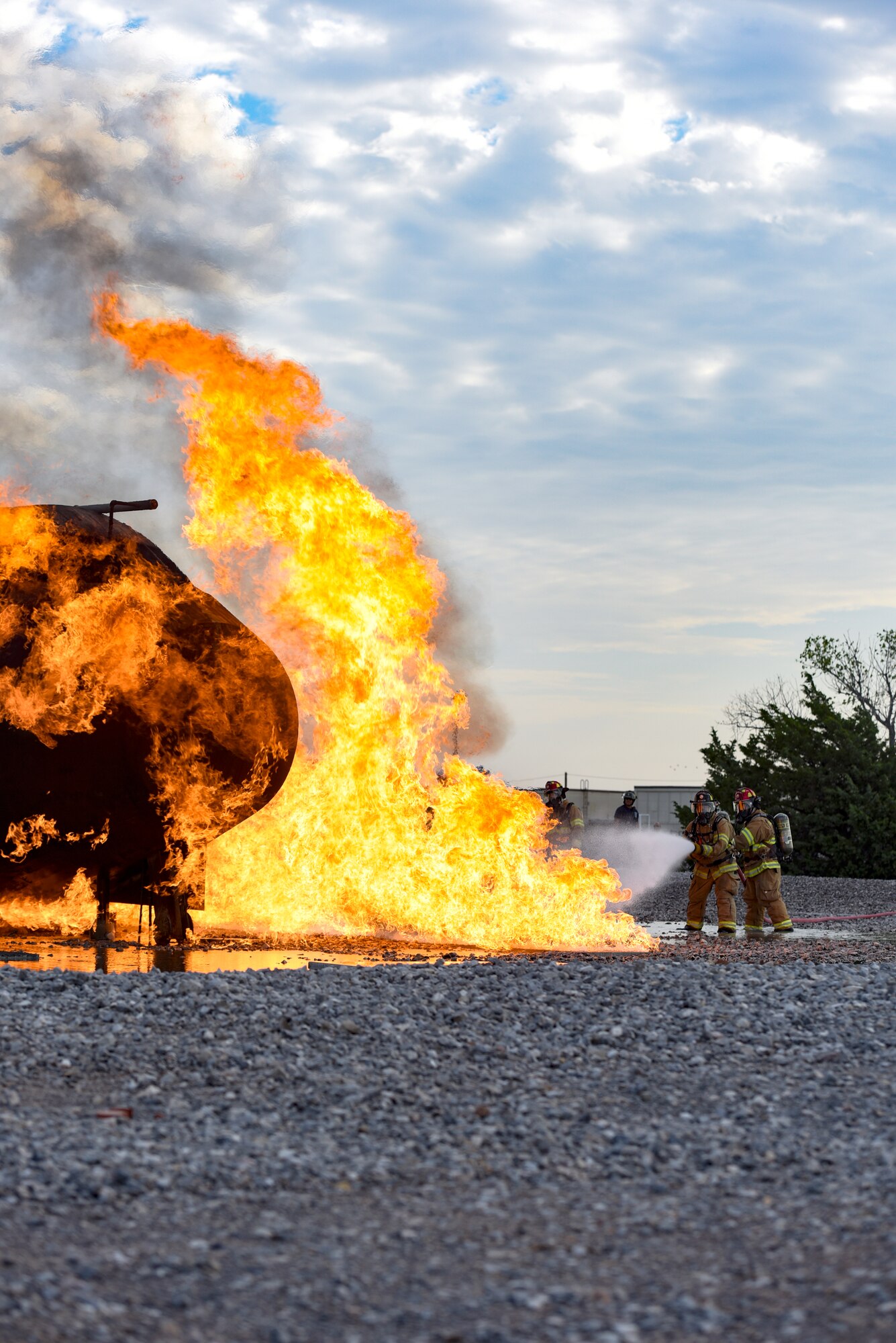 Fire fighters train at a special training area that simulates a plane crash.