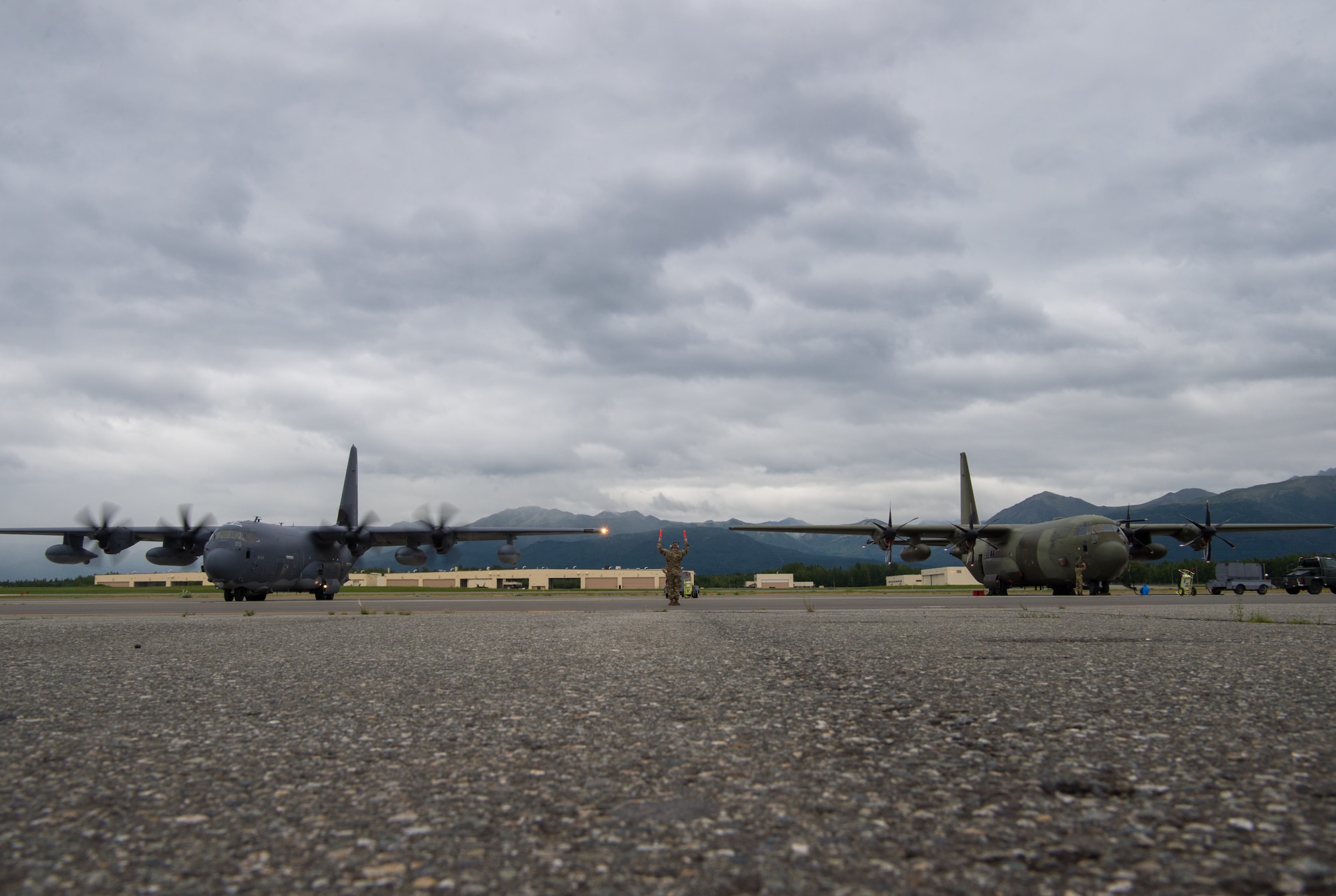 A C-130J Super Hercules from Kadena Air Force Base, Japan, and a C-130J Hercules from the United Kingdom Royal Air Force prepare for flight during Red Flag-Alaska 18-3 at Joint Base Elmendorf-Richardson, Alaska, Aug. 13, 2018. In RF-A 18-3 U.S. Army and Navy aviators in addition to Air Force Airmen are expected to fly, maintain and support more than 100 aircraft from more than a dozen units during this iteration of the exercise.