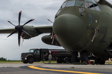 U.S. Air Force Staff Sgt. Gabriel Materas, 144th Fighter Wing crew chief from Fresno Air National Guard Base, California, fuels a United Kingdom Royal Air Force C-130J during Red Flag-Alaska 18-3 at Joint Base Elmendorf-Richardson, Alaska, Aug. 13, 2018. In RF-A 18-3 U.S. Army and Navy aviators in addition to Air Force Airmen are expected to fly, maintain and support more than 100 aircraft from more than a dozen units during this iteration of the exercise.