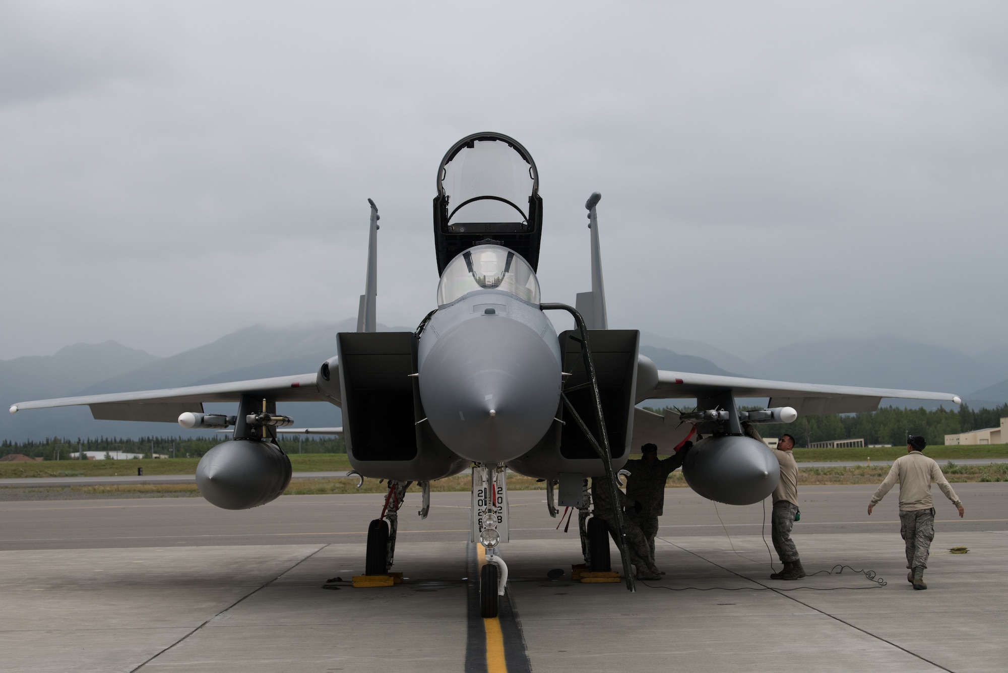 U.S. Air Force crew chiefs from the 144th Fighter Wing, Fresno Air National Guard Base, California, perform maintenance on an F-15C Eagle during Red Flag-Alaska 18-3 at Joint Base Elmendorf-Richardson, Alaska, Aug. 13, 2018. RF-A is a Pacific Air Forces-directed field training exercise for U.S. and international forces flown under simulated air combat conditions.