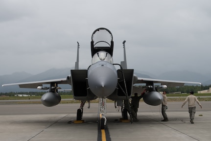 U.S. Air Force crew chiefs from the 144th Fighter Wing, Fresno Air National Guard Base, California, perform maintenance on an F-15C Eagle during Red Flag-Alaska 18-3 at Joint Base Elmendorf-Richardson, Alaska, Aug. 13, 2018. RF-A is a Pacific Air Forces-directed field training exercise for U.S. and international forces flown under simulated air combat conditions.
