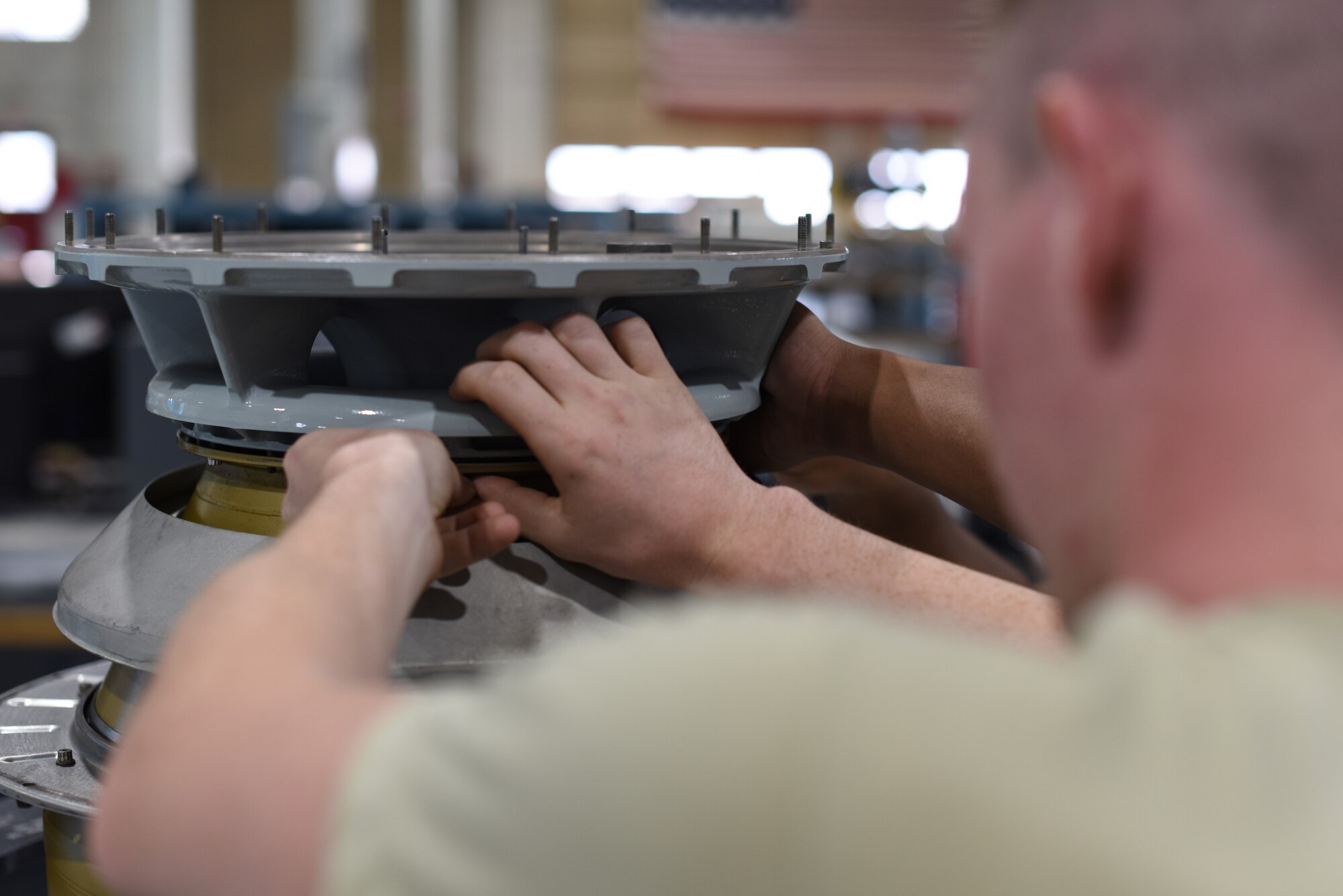 Airmen assigned to the 58th Maintenance Squadron work on a helicopter engine at Kirtland Air Force Base, N.M., Aug. 21, 2018. The 58th MXS rebuilds and tests engines for the HH-60G Pave Hawk search and rescue helicopter, as well as the UH-1N Huey, an Air Force Global Strike Command aircraft used to support missile-field operations. (U.S. Air Force photo by Senior Airman Eli Chevalier)