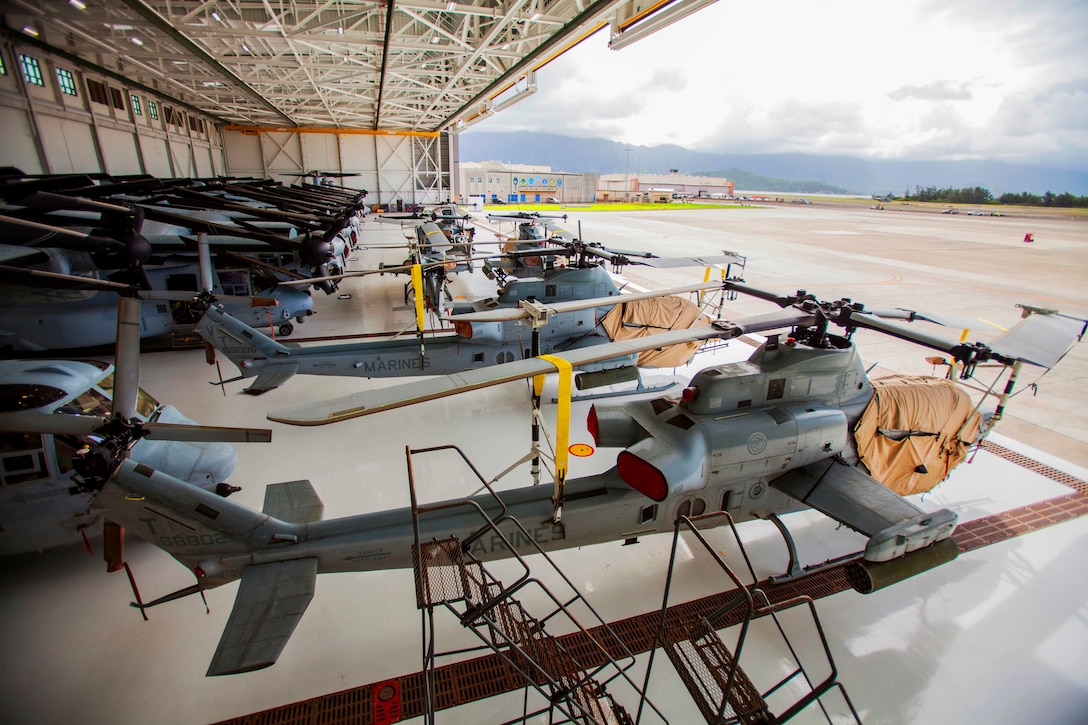 Marines secure vehicles, aircraft and equipment.