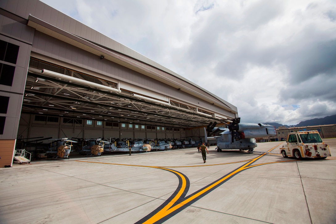 Marines park an MV-22 Osprey aircraft inside Hangar 7 prior to Hurricane Lane’s arrival.