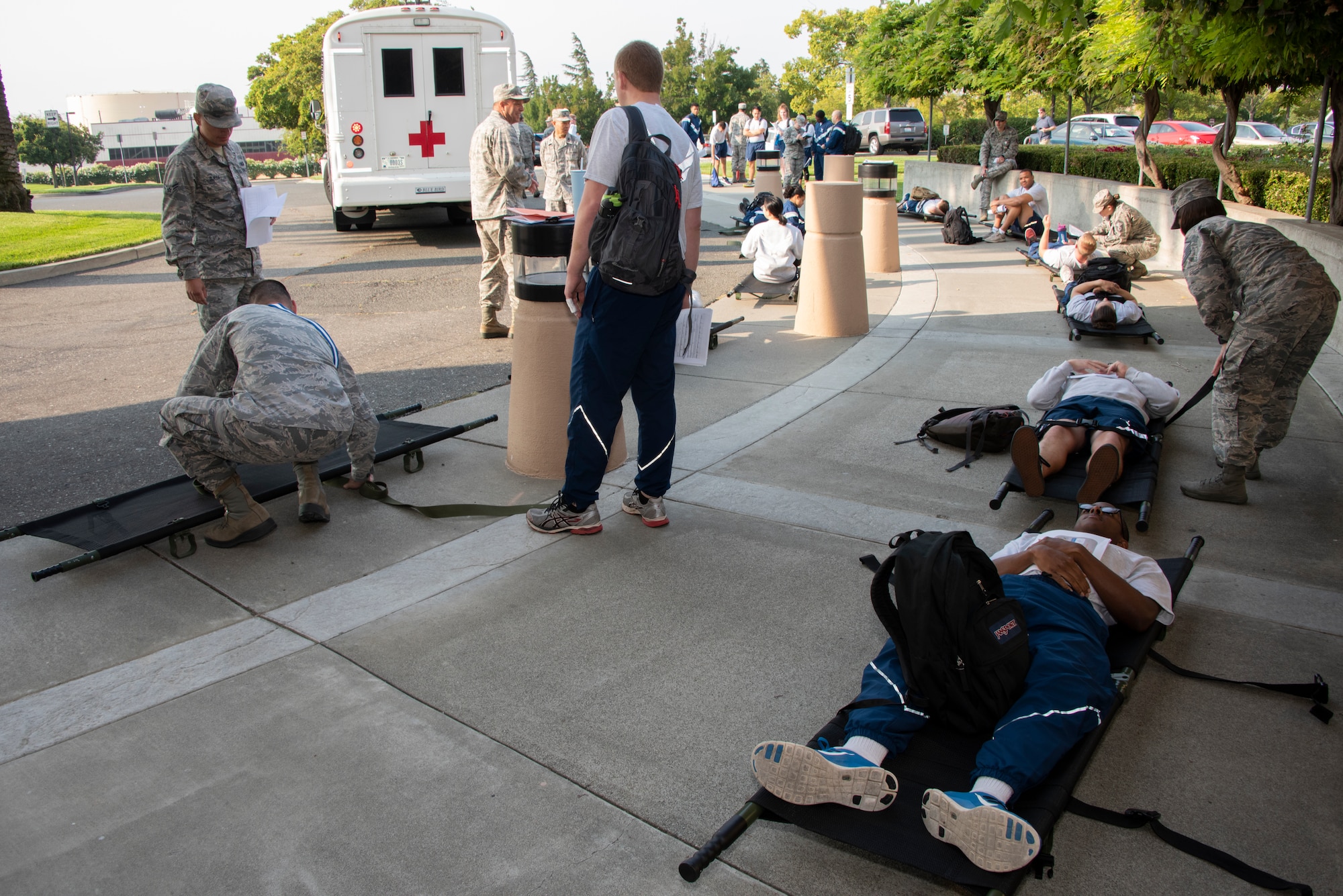 U.S. Air Force Airmen from the 60th Medical Group work to triage and treat simulated patients at David Grant USAF Medical Center during a Casualty Receiving Hospital exercise at Travis Air Force Base, Calif., Aug. 22, 2018. The exercise simulated bringing injured troops from overseas, triaging them at Travis and then moving them to long-term and advanced-care facilities. (U.S. Air Force Photo by Heide Couch)