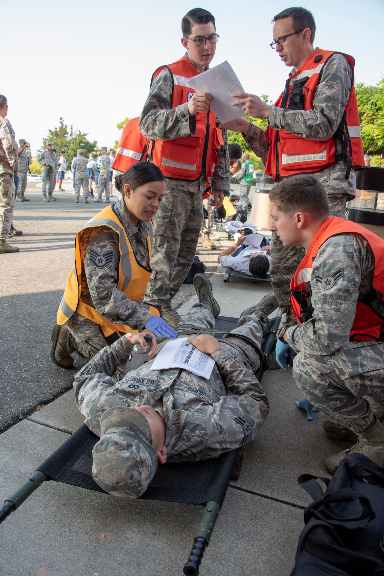 U.S. Air Force Airmen from the 60th Medical Group work to triage and treat simulated patients at David Grant USAF Medical Center during a Casualty Receiving Hospital exercise at Travis Air Force Base, Calif., August 22, 2018. The exercise simulated bringing in injured troops from overseas, triaging them at Travis, and then moving them to longer-term and advanced-care facilities. (U.S. Air Force Photo by Heide Couch)