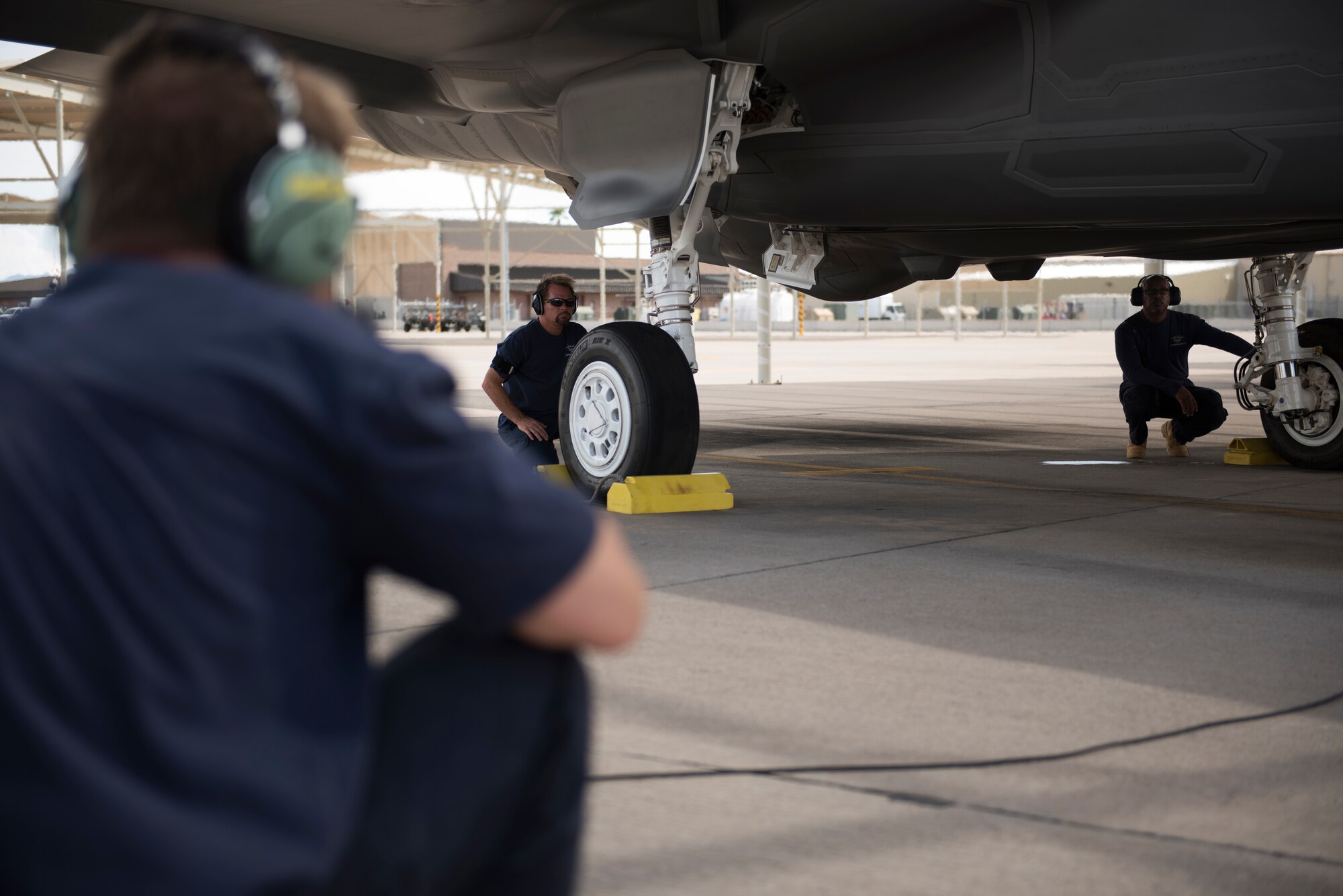Lockheed Martin maintainers perform final checks on a 62nd Fighter Squadron F-35A Lightning II before it taxis out to launch Aug. 22, 2018, at Luke Air Force Base, Ariz.