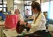 Wendy Sniegowski, right, Davis-Monthan Thrift Shop manager, and Cathy Bradford, left, assistant manager, wrap up and check out merchandise for a customer at D-M Thrift Shop on D-M Air Force Base, Ariz., August 22, 2018.