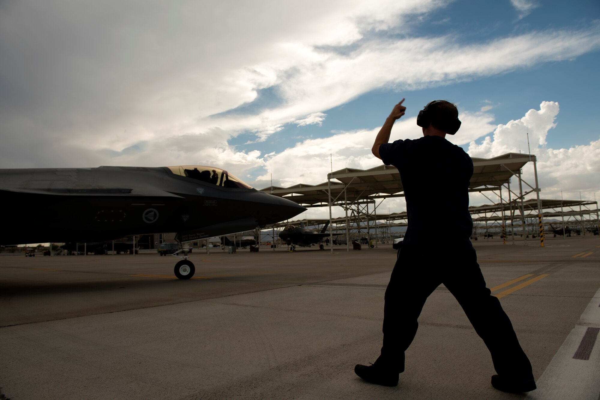 A 62nd Aircraft Maintenance Unit crew chief taxis out a 62nd Fighter Squadron F-35A Lightning II for a training sortie Aug. 22, 2018, at Luke Air Force Base, Ariz.