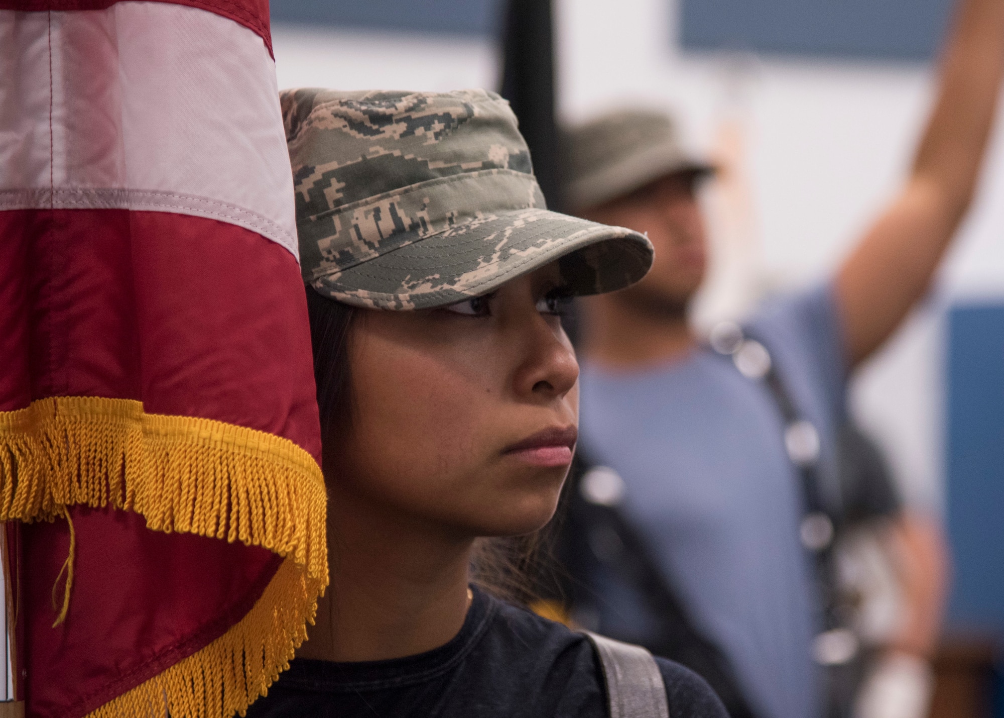 A base Honor Guard trainee pays attention to flag bearing instruction at Fairchild Air Force Base, Washington, Aug. 4, 2018. Honor Guard trainees practice through the weekend during their training phase, as they will perform ceremonies any day of the week for a four month term. (U.S. Air Force photo/Senior Airman Ryan Lackey)