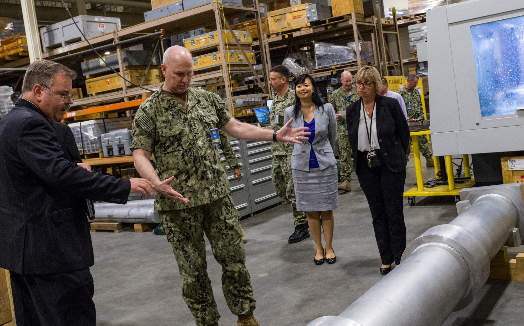 Richard Schumacher, Measurement Science and Engineering Department head, shows a Standard Missile MK-29 vertical launch system canister fit-check tool to Adm. Christopher Grady, U.S. Fleet Forces Commander