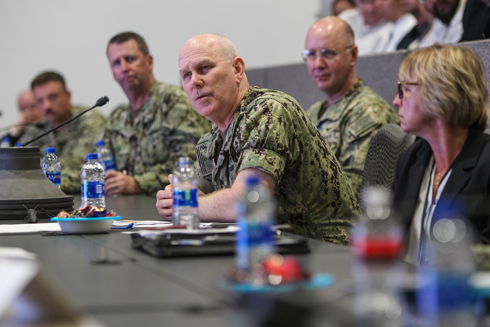 Adm. Christopher Grady, U.S. Fleet Forces Commander, asks a question during a visit at Naval Surface Warfare Center, Corona Division (NSWC Corona).