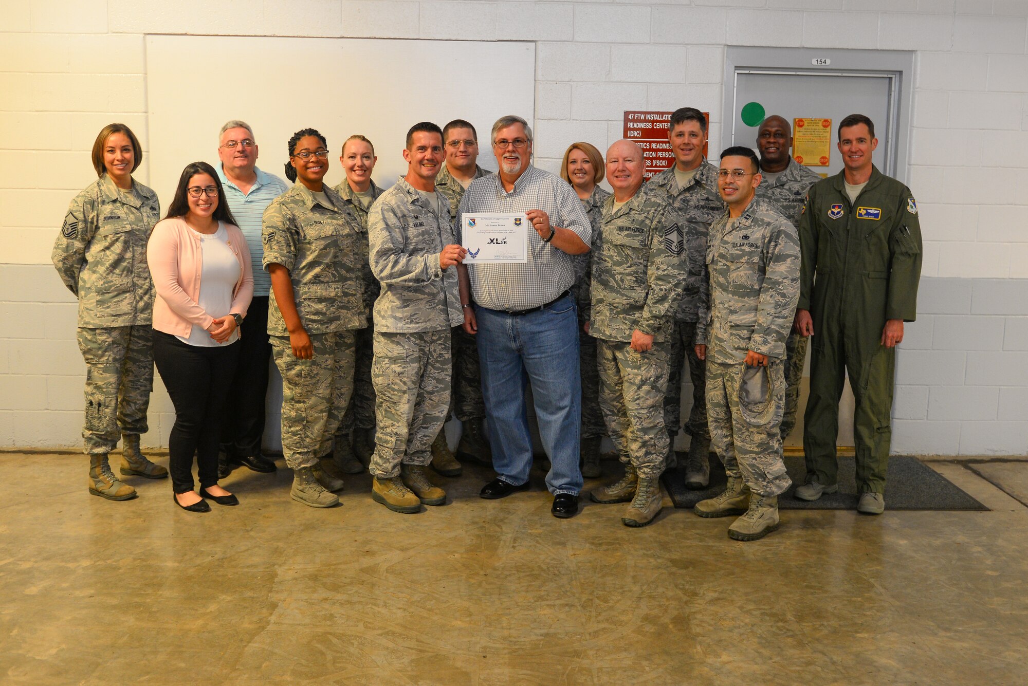 James Brown, 47th Logistics Readiness Flight installation deployment officer, was chosen by wing leadership to be the “XLer” of the week, for the week of August 13, 2018, at Laughlin Air Force Base, Texas. The “XLer” award, presented by Col. Charlie Velino, 47th Flying Training Wing commander, is given to those who consistently make outstanding contributions to their unit and the Laughlin mission. (U.S. Air Force photo by Senior Airman Benjamin N. Valmoja)