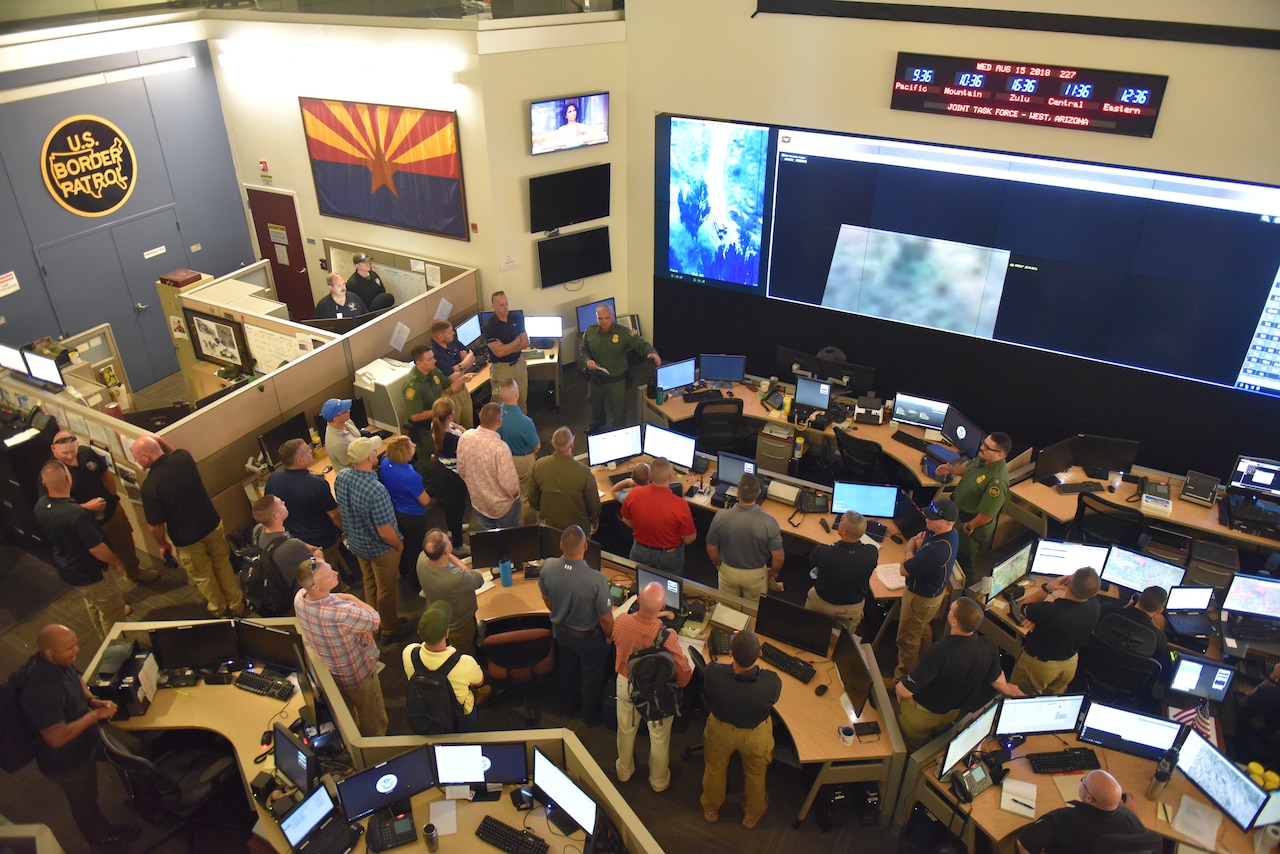 Army Command Sgt. Maj. John Wayne Troxell, senior enlisted advisor to the chairman of the Joint Chiefs of Staff, and his 24-member Defense Senior Enlisted Leader Council listen to a presentation by the U.S. Customs and Border Protection’s Joint Task Force West command center in Tucson, Ariz.