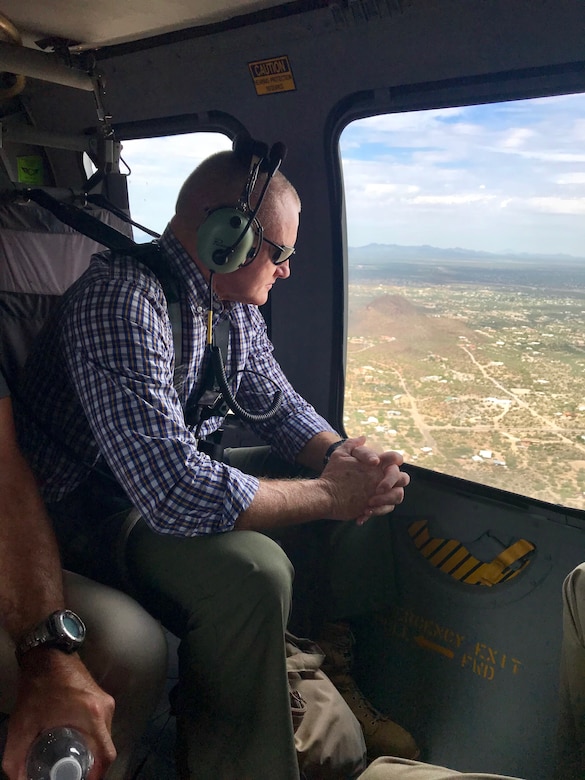 Marine Corps Sgt. Maj. Paul McKenna of North American Aerospace Defense Command and U.S. Northern Command surveils the rural, expansive U.S.-Mexico border area from a Black Hawk helicopter.